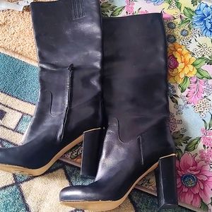 Michael kors tall black boot. 3 inch heel. Zip on inside. Good used condition.